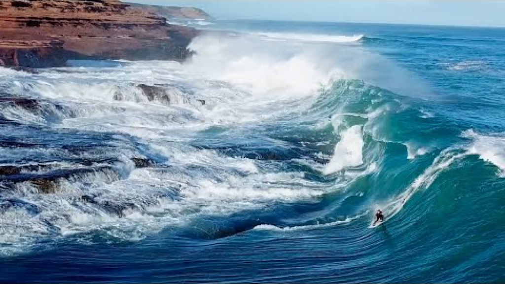Kerby Brown Takes a Dangerous Line Next to Dry Rocks Whilst Surfing a